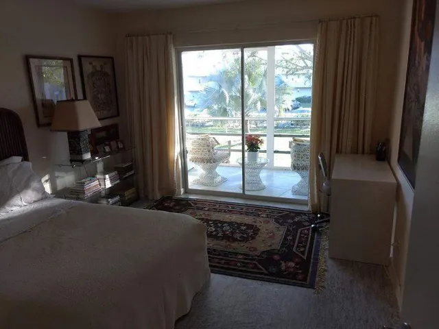 a bathroom with a toilet and shower