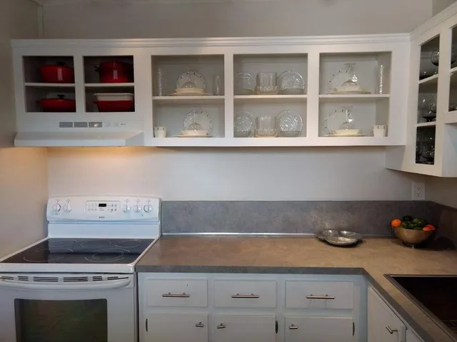 a kitchen with a stove and cabinets