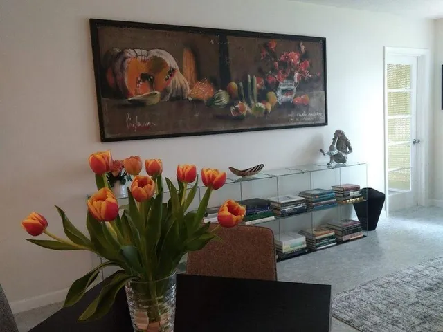 a bedroom with a bed and a lamp