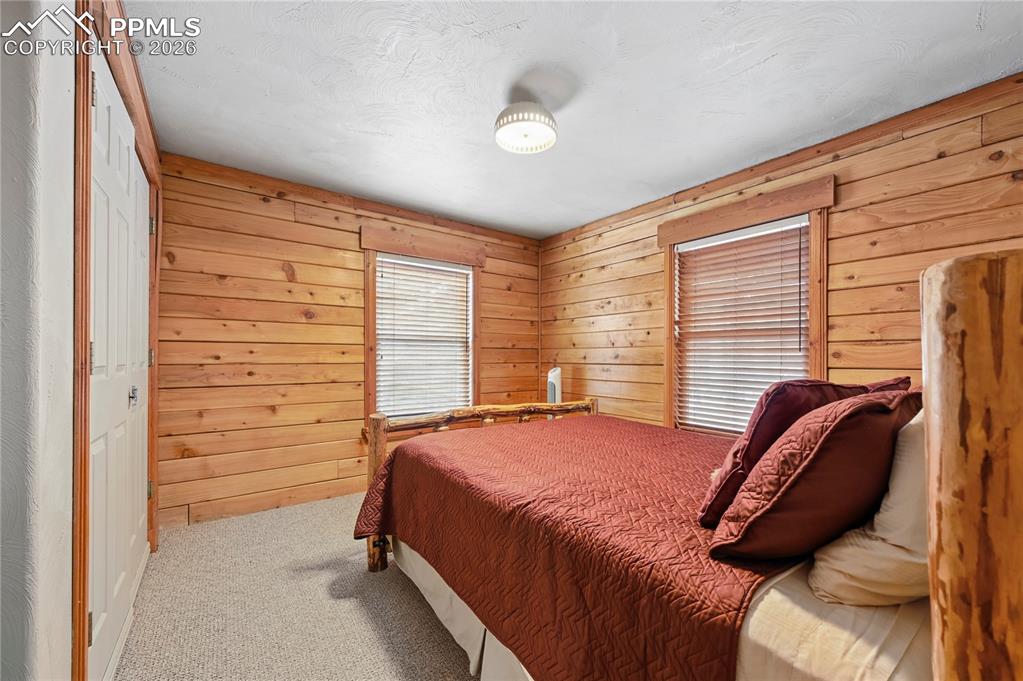 3613 Trail Creek Road Florissant, CO 80816 - Photo 18 of 43 a bedroom with a bed and a window