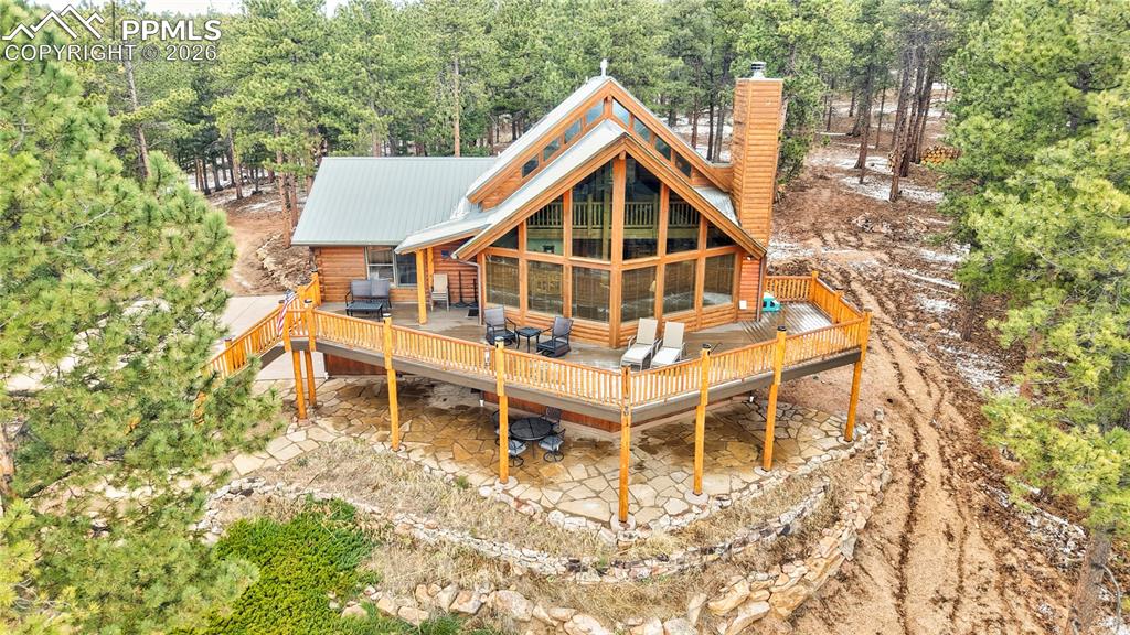 3613 Trail Creek Road Florissant, CO 80816 - Photo 2 of 43 a front view of a house with a yard