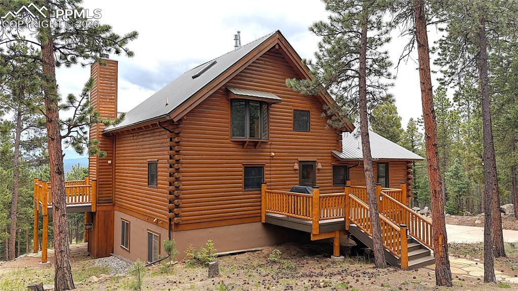 3613 Trail Creek Road Florissant, CO 80816 - Photo 5 of 43 a view of house with a yard and furniture