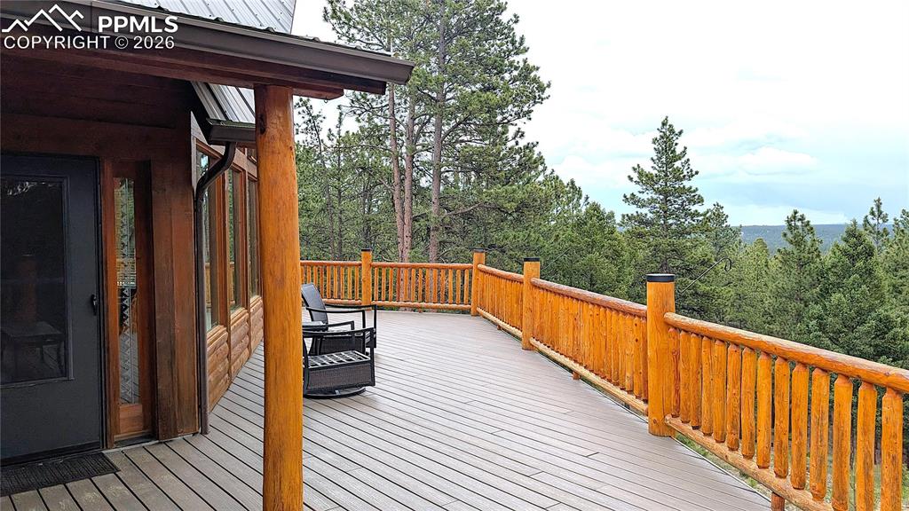 3613 Trail Creek Road Florissant, CO 80816 - Photo 7 of 43 a view of balcony with wooden floor and seating space