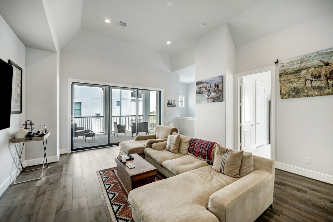 6103 Alexandra Grove Place Houston, TX 77055 - Photo 15 of 19 Third floor game room with access to outdoor balcony, bedroom and with an office nook
