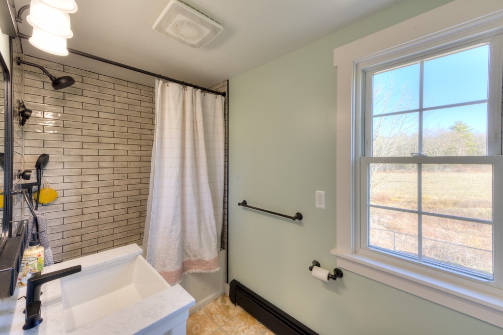 57 Carpenter Hill Road Charlton, MA 01507 - Photo 13 of 16 a bathroom with a sink and a shower