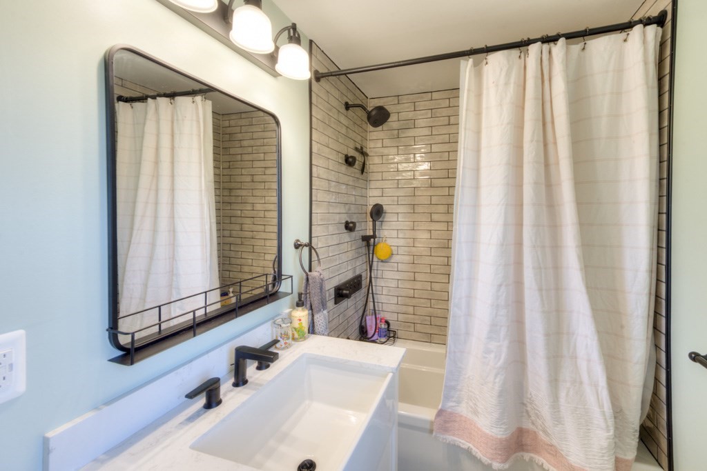 57 Carpenter Hill Road Charlton, MA 01507 - Photo 14 of 16 a bathroom with a sink and a mirror