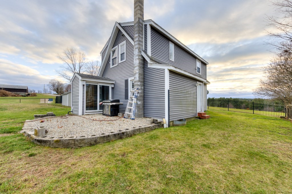 57 Carpenter Hill Road Charlton, MA 01507 - Photo 5 of 16 a view of a house with backyard and sitting area