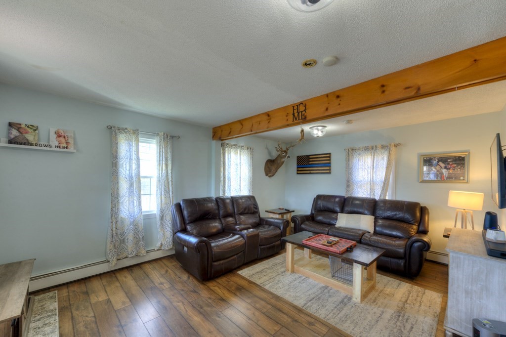 57 Carpenter Hill Road Charlton, MA 01507 - Photo 7 of 16 a living room with furniture and wooden floor