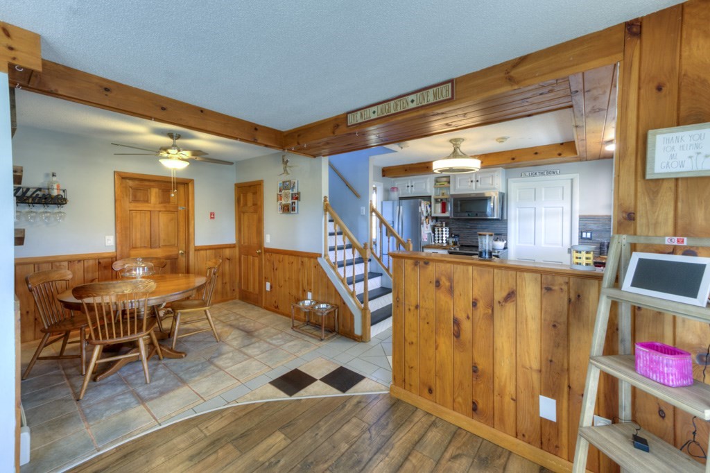 57 Carpenter Hill Road Charlton, MA 01507 - Photo 8 of 16 a view of a dining room with furniture and a rug