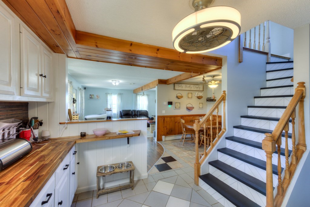 57 Carpenter Hill Road Charlton, MA 01507 - Photo 9 of 16 a kitchen with lots of counter space and wooden floor