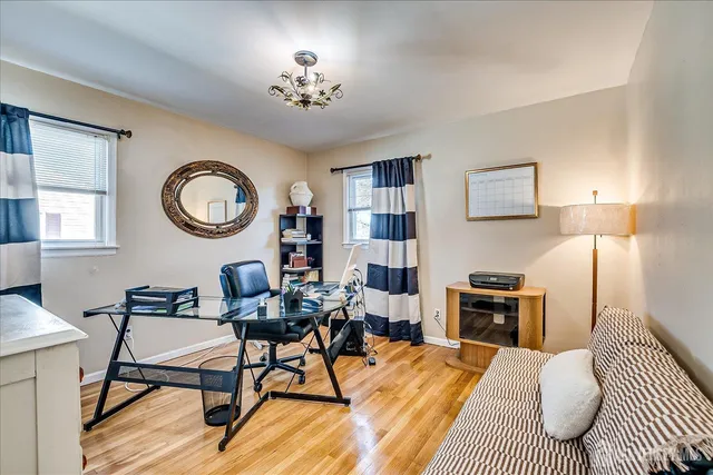 a bedroom with furniture and a chandelier