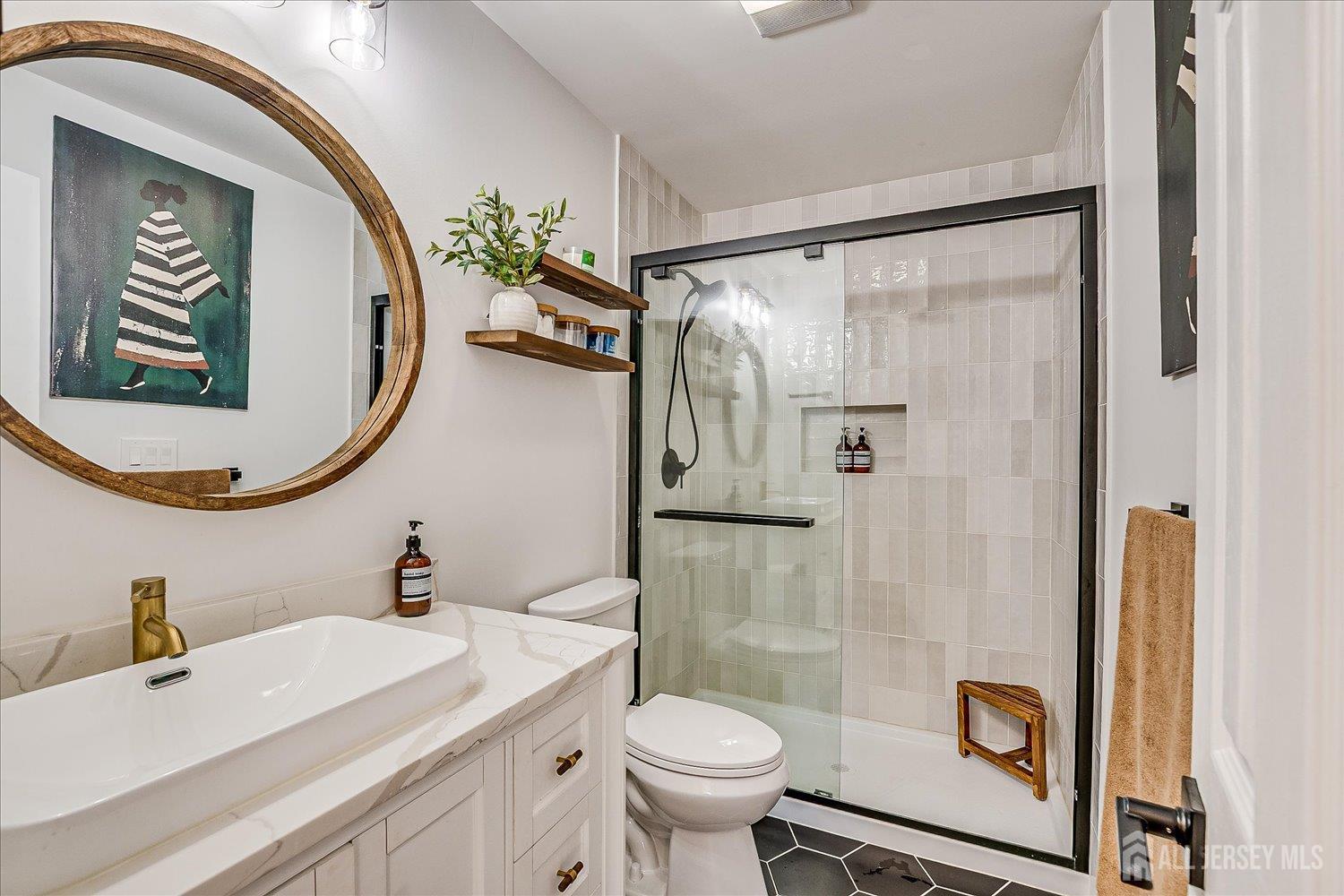 105 Madison Avenue Middlesex, NJ 08846 - Photo 16 of 27 a bathroom with a sink and a mirror