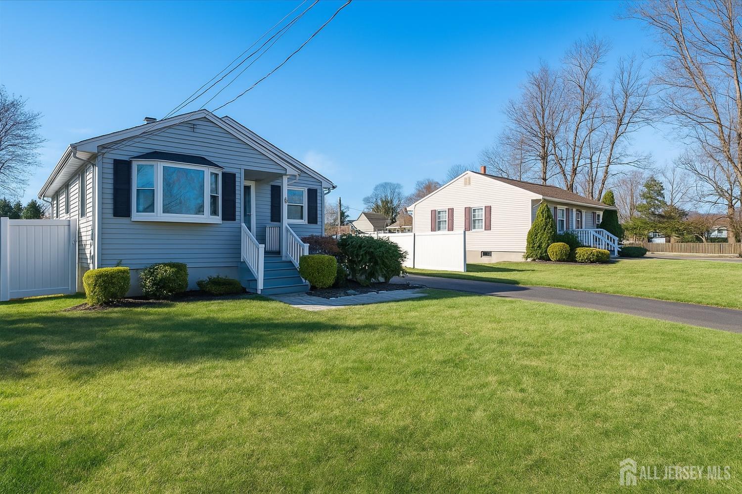 105 Madison Avenue Middlesex, NJ 08846 - Photo 2 of 27 a front view of a house with a garden