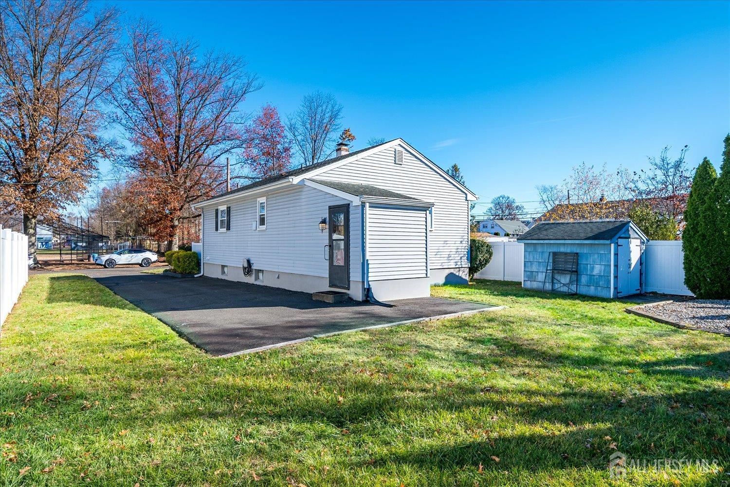 105 Madison Avenue Middlesex, NJ 08846 - Photo 26 of 27 a view of a yard in front of a house with large trees
