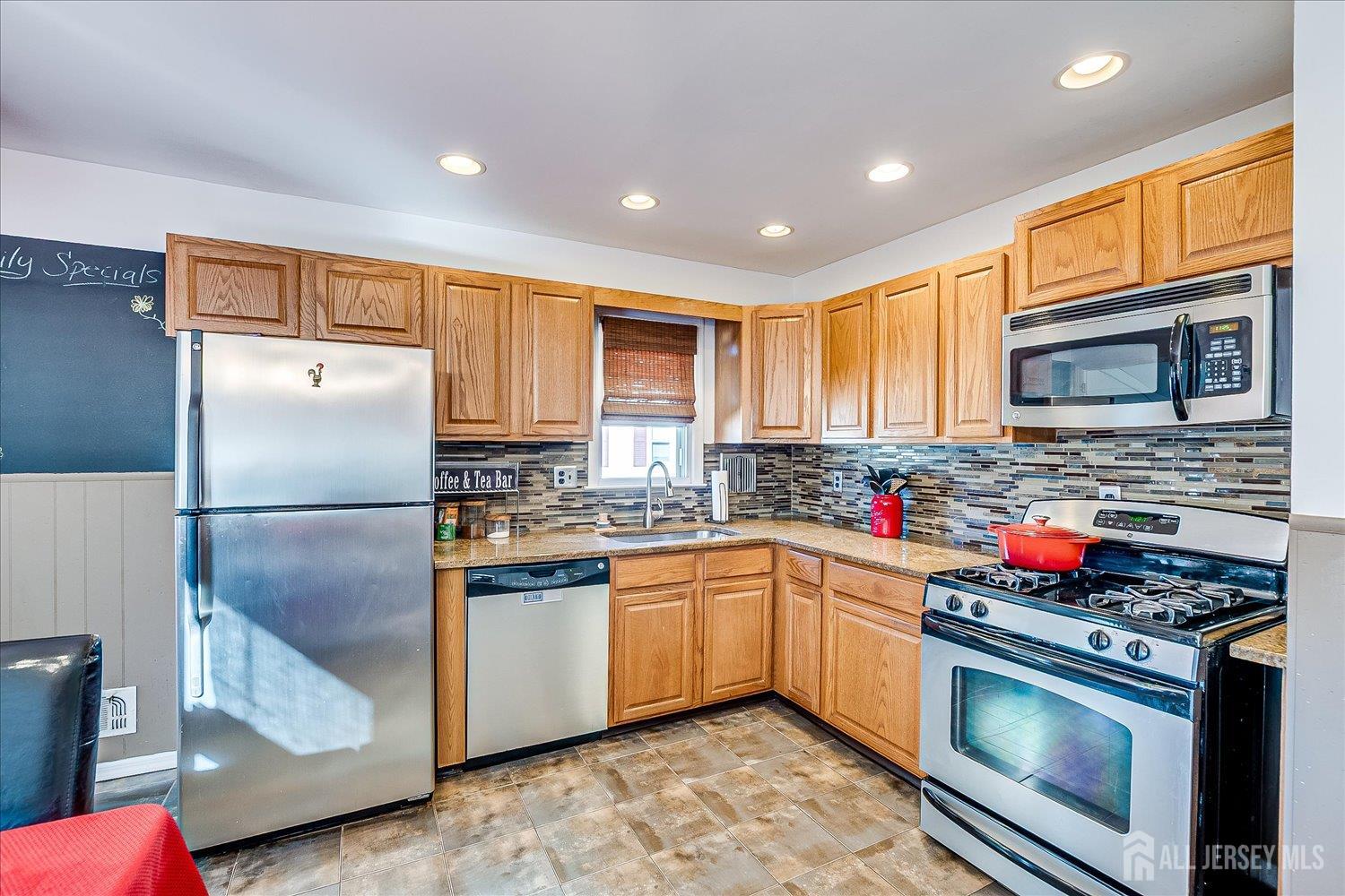 105 Madison Avenue Middlesex, NJ 08846 - Photo 9 of 27 a kitchen with stainless steel appliances granite countertop a refrigerator stove microwave and sink