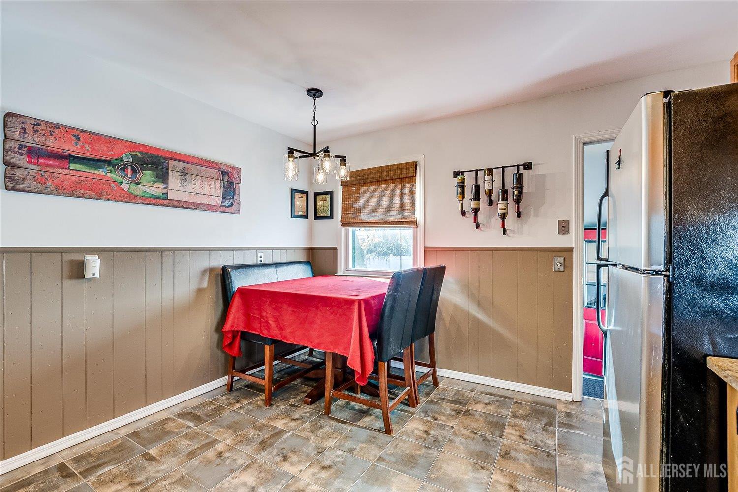 105 Madison Avenue Middlesex, NJ 08846 - Photo 10 of 27 a view of a dining room with furniture and chandelier
