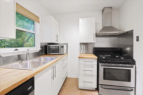 a kitchen with a stove and a sink