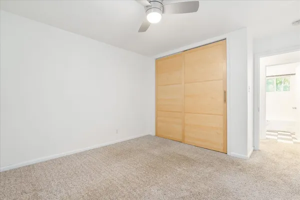 an empty room with fan