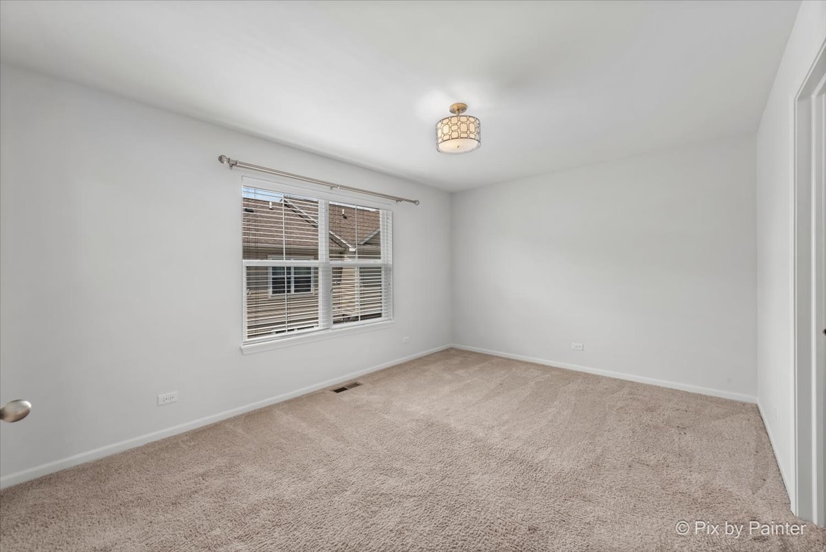 1196 Colfax Avenue Des Plaines, IL 60016 - Photo 15 of 28 an empty room with a window