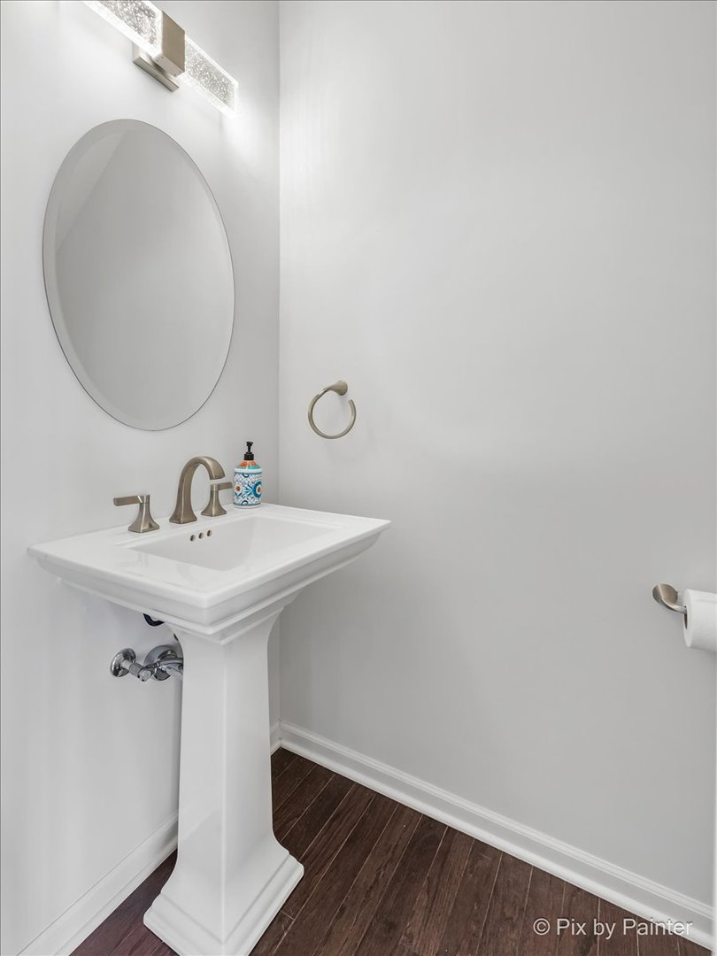 1196 Colfax Avenue Des Plaines, IL 60016 - Photo 19 of 28 a bathroom with a sink and mirror