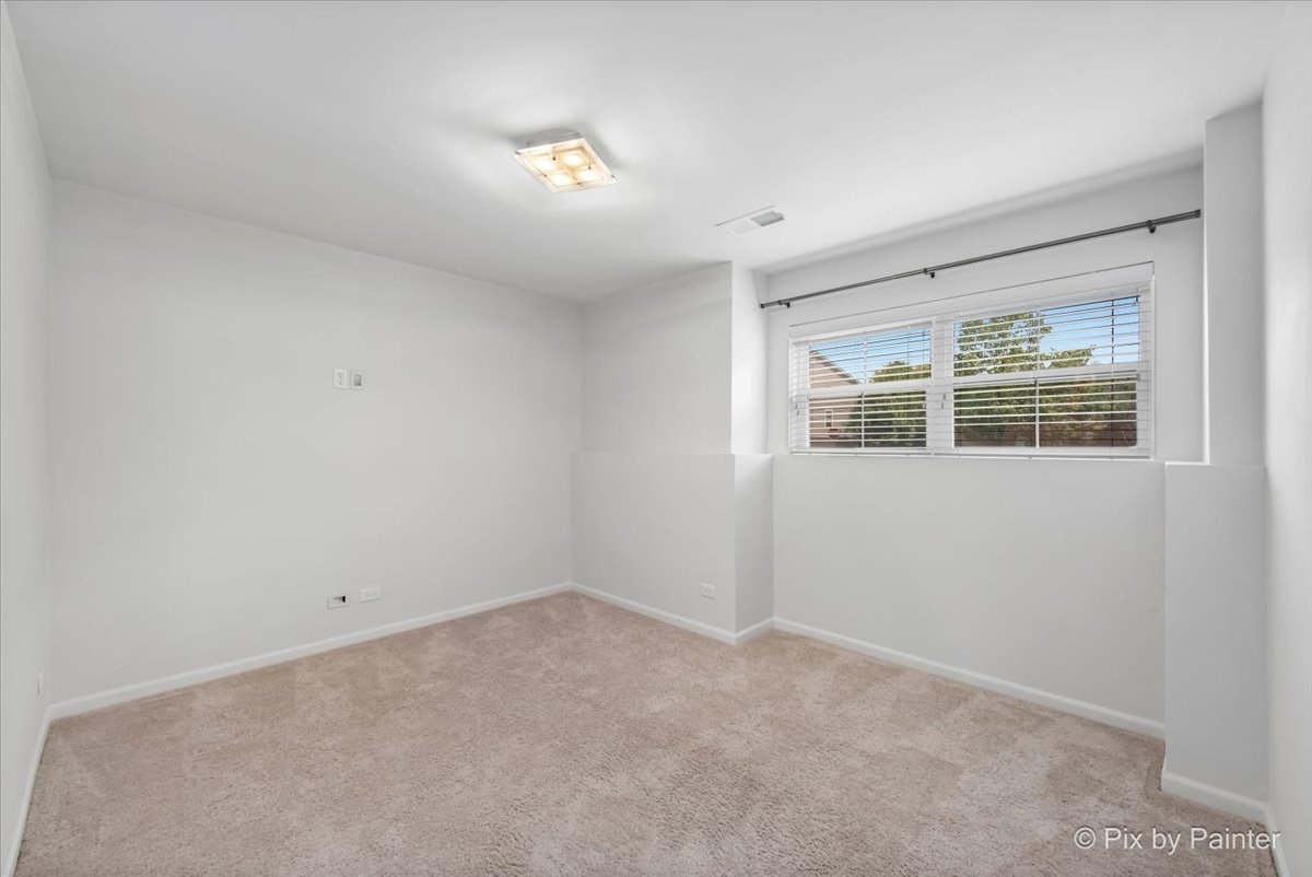 1196 Colfax Avenue Des Plaines, IL 60016 - Photo 22 of 28 a view of empty room with windows