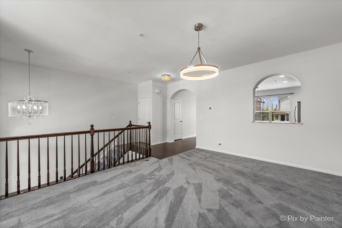 1196 Colfax Avenue Des Plaines, IL 60016 - Photo 3 of 28 a view of a hallway with a chandelier