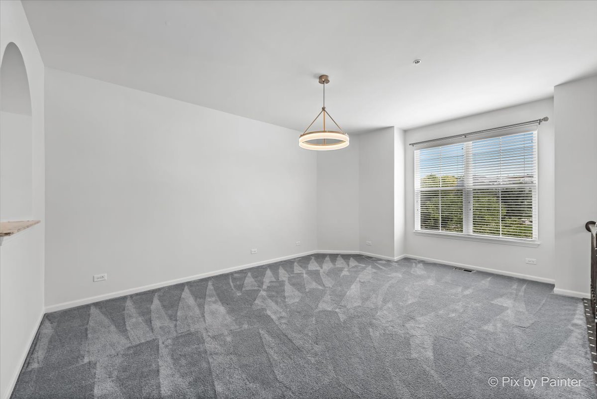 1196 Colfax Avenue Des Plaines, IL 60016 - Photo 4 of 28 a view of an empty room with a window