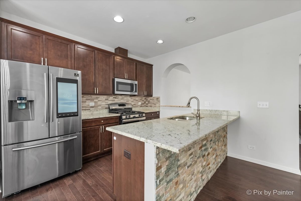 1196 Colfax Avenue Des Plaines, IL 60016 - Photo 6 of 28 a kitchen with a sink appliances and cabinets