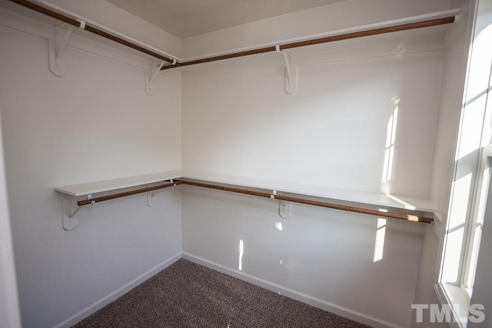 1856 Swepsonville Road Graham, NC 27253 - Photo 16 of 25 a view of a room with racks on the wall