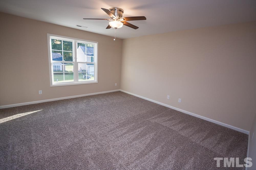 1856 Swepsonville Road Graham, NC 27253 - Photo 17 of 25 a view of an empty room with a window