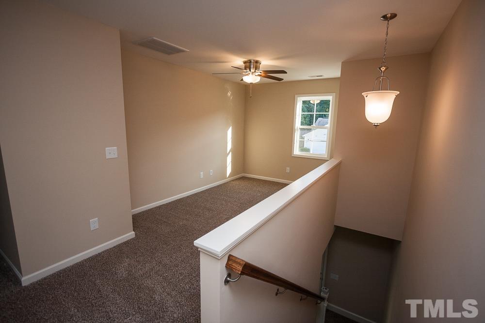 1856 Swepsonville Road Graham, NC 27253 - Photo 25 of 25 a view of an empty room with window and cabinet