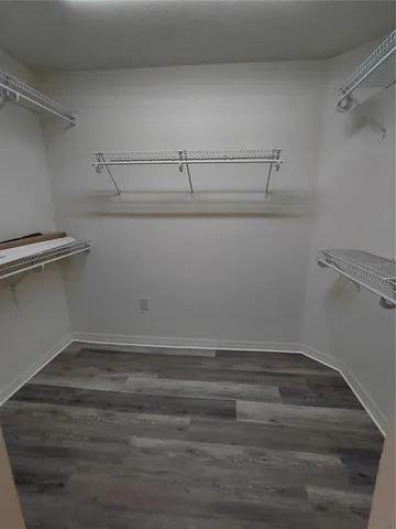 a view of a room with racks on the wall