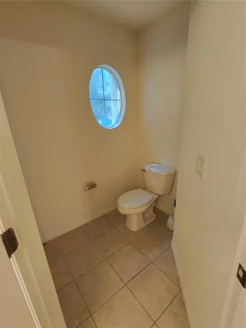 a bathroom with a toilet and a sink
