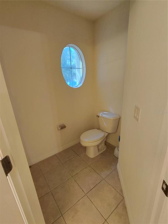 14295 Southwest 17th Place Ocala, FL 34481 - Photo 16 of 34 a bathroom with a toilet and a sink