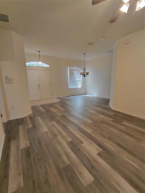 14295 Southwest 17th Place Ocala, FL 34481 - Photo 18 of 34 a view of empty room with wooden floor
