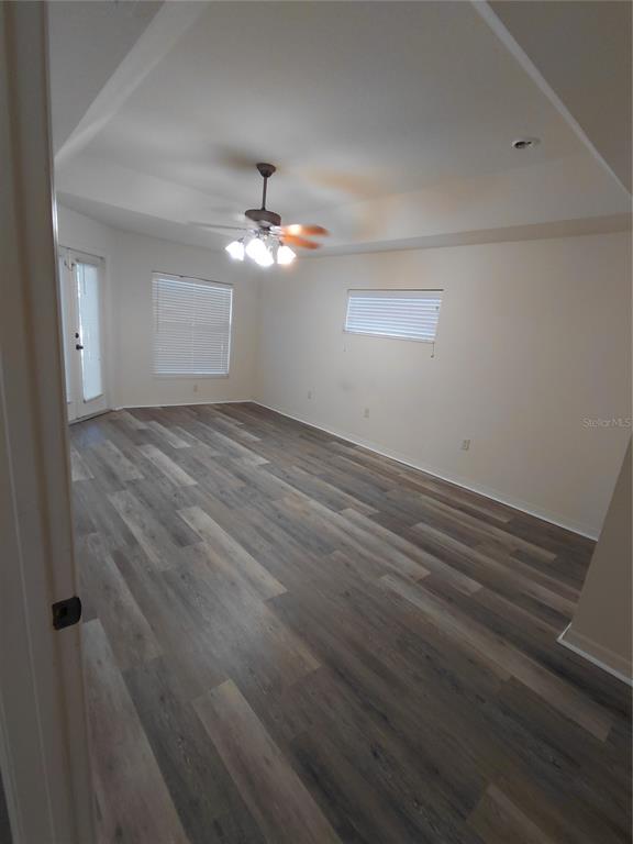 14295 Southwest 17th Place Ocala, FL 34481 - Photo 21 of 34 wooden floor in an empty room with a window