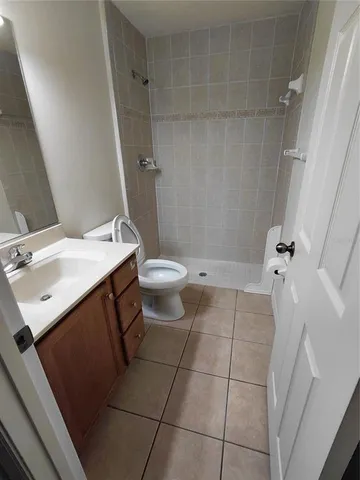 a view of a room with wooden floors and led lights