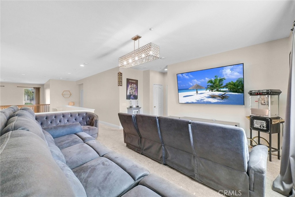 11499 Bridgeway Drive Riverside, CA 92505 - Photo 31 of 70 a living room with furniture and a flat screen tv