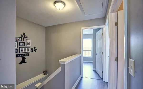 a bedroom with a bed and a ceiling fan