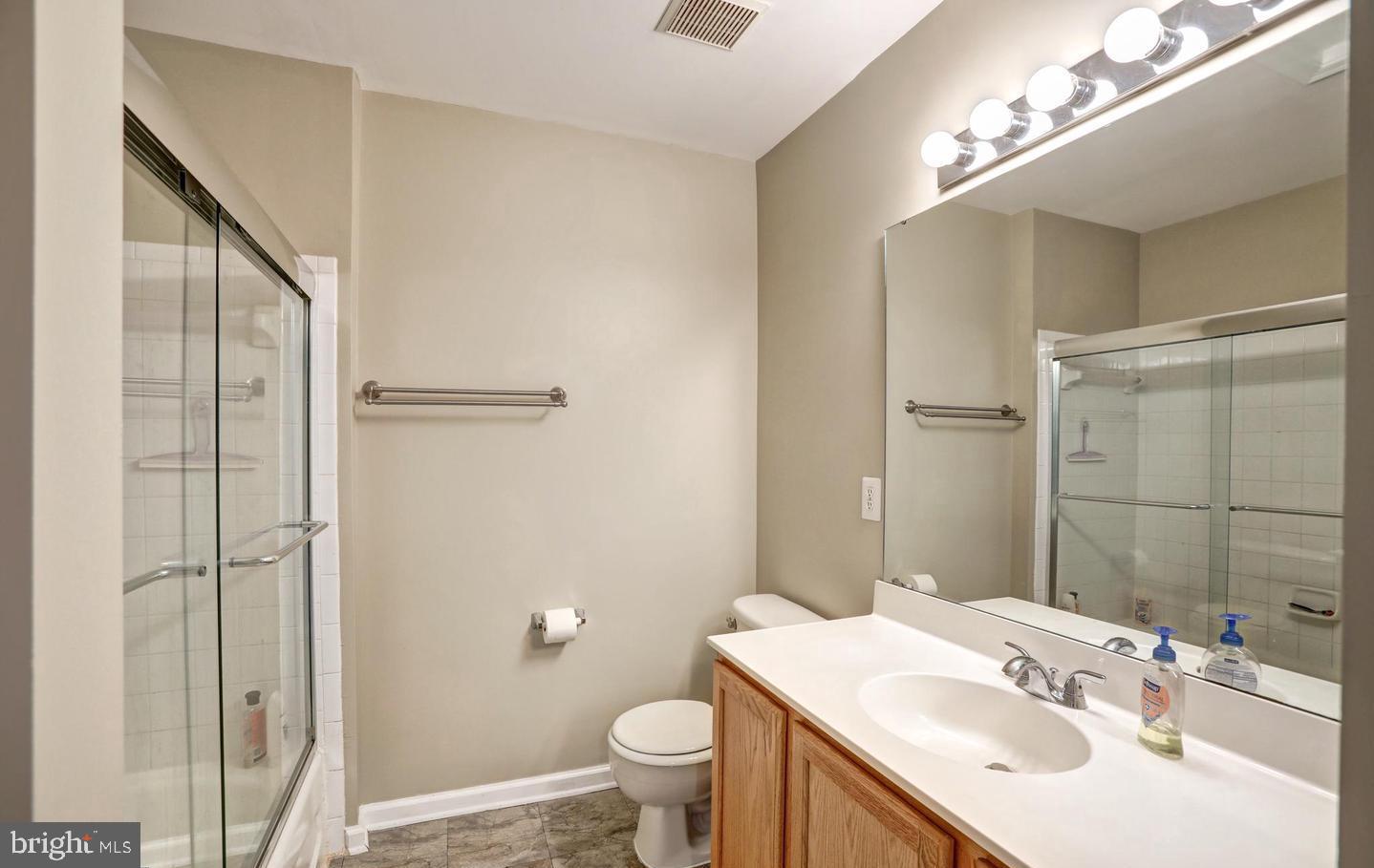 102 Cagney Terrace Southeast Leesburg, VA 20175 - Photo 23 of 26 a bathroom with a sink toilet and shower