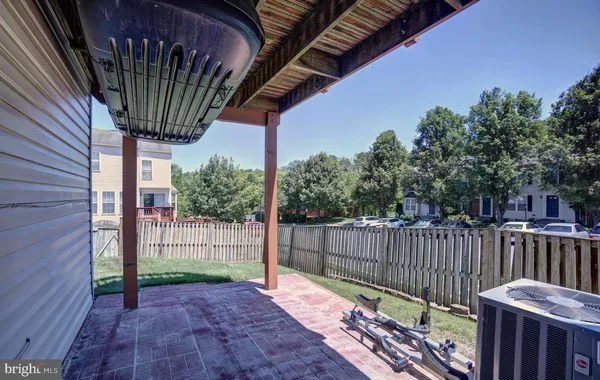a view of a house with backyard and porch