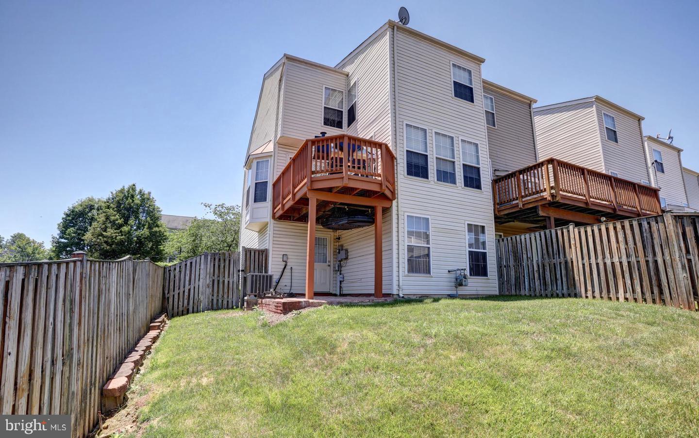 102 Cagney Terrace Southeast Leesburg, VA 20175 - Photo 26 of 26 a view of a house with wooden fence