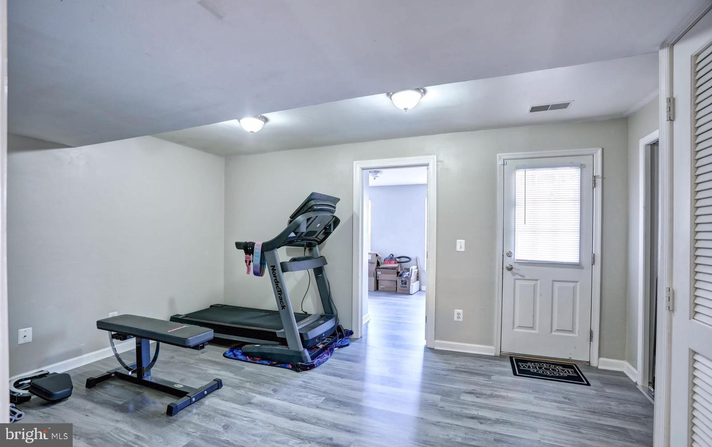 102 Cagney Terrace Southeast Leesburg, VA 20175 - Photo 3 of 26 a view of a room with gym equipment