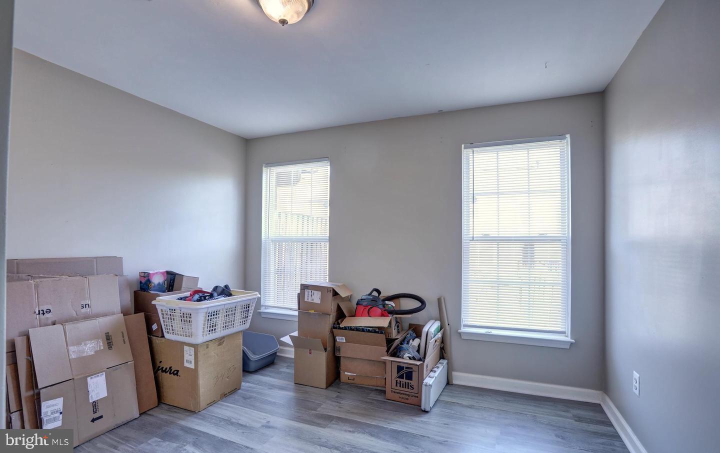 102 Cagney Terrace Southeast Leesburg, VA 20175 - Photo 4 of 26 a view of a workspace with furniture and a window