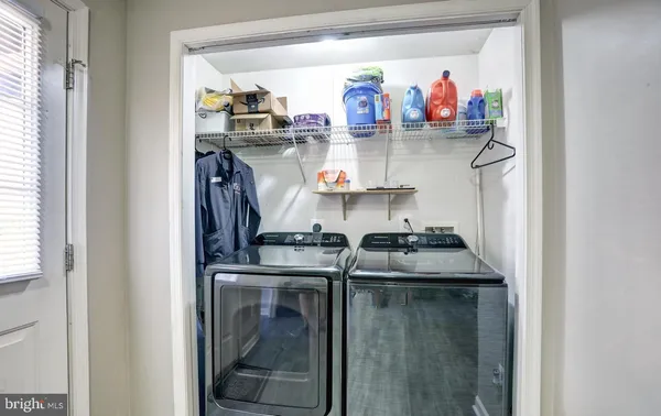 a kitchen with stainless steel appliances granite countertop a stove and cabinets