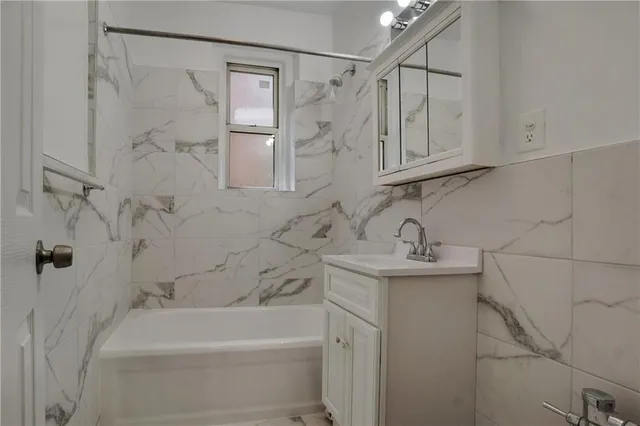 a bathroom with a sink a toilet and bathtub