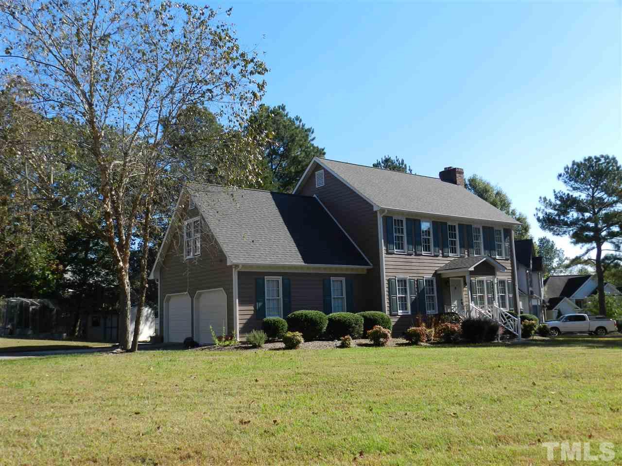103 Rother Lane Durham, NC 27707 - Photo 2 of 24 a front view of a house with a garden