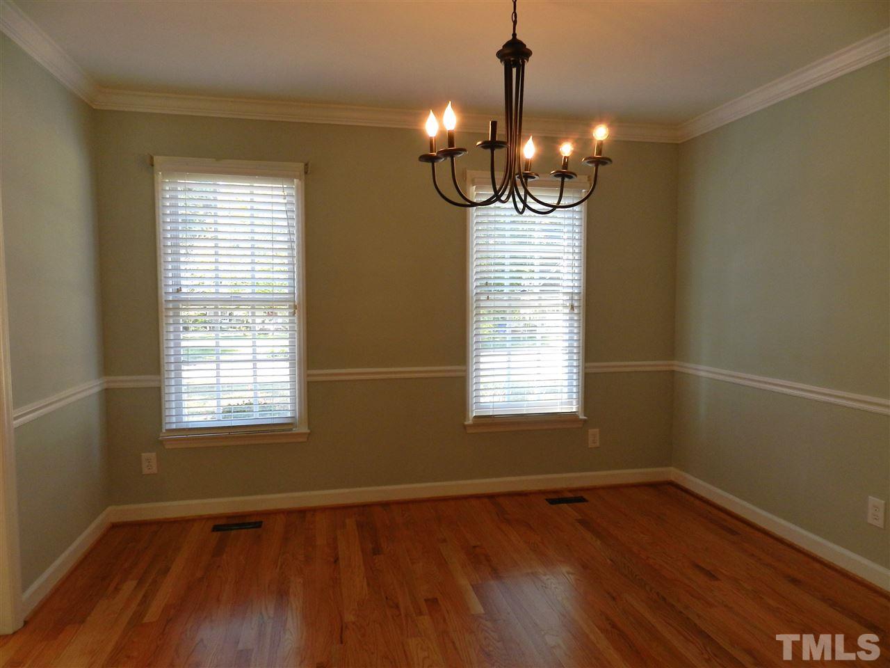103 Rother Lane Durham, NC 27707 - Photo 13 of 24 a view of an empty room with wooden floor and a window