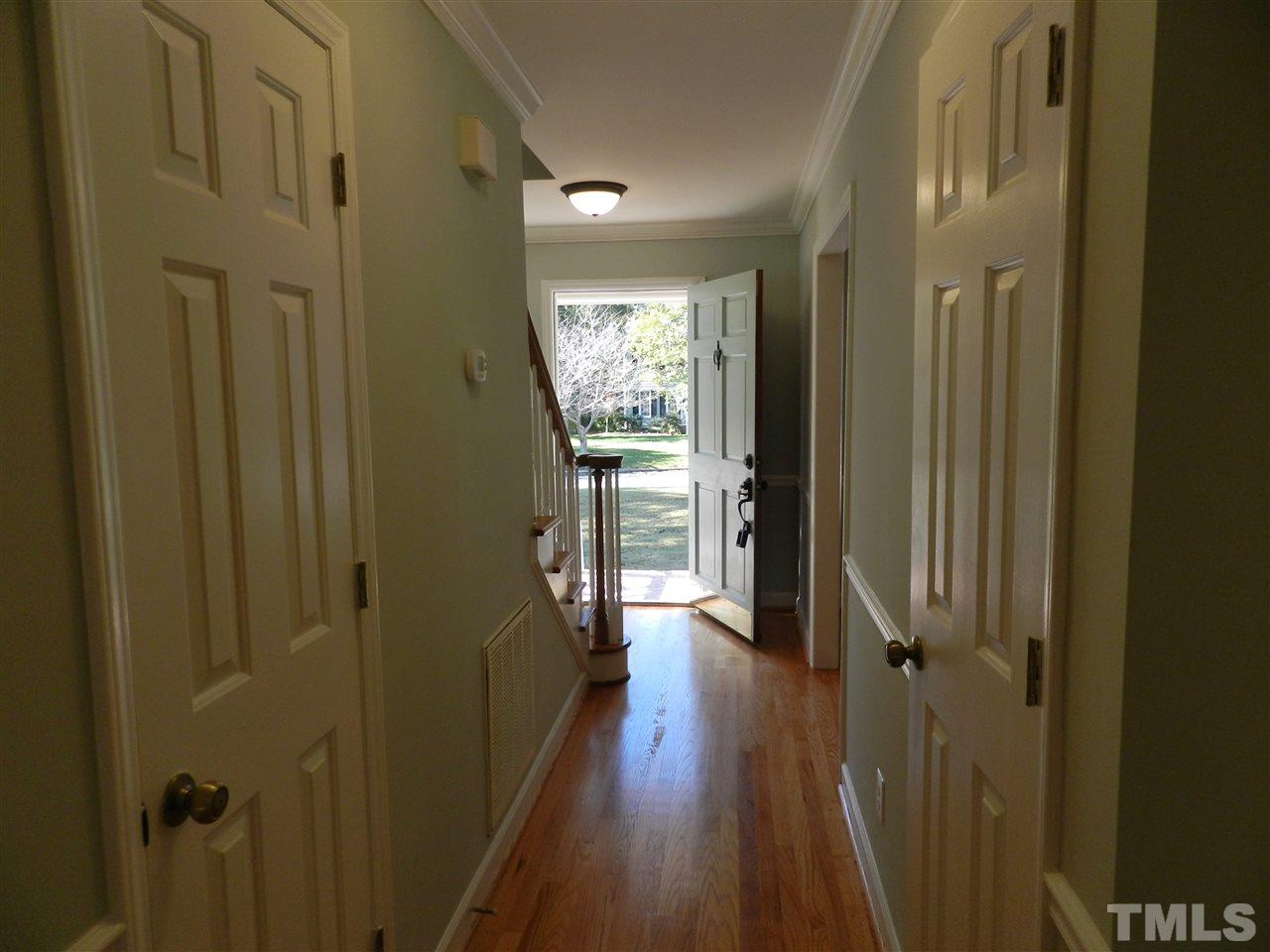 103 Rother Lane Durham, NC 27707 - Photo 14 of 24 a view of a hallway with wooden floor