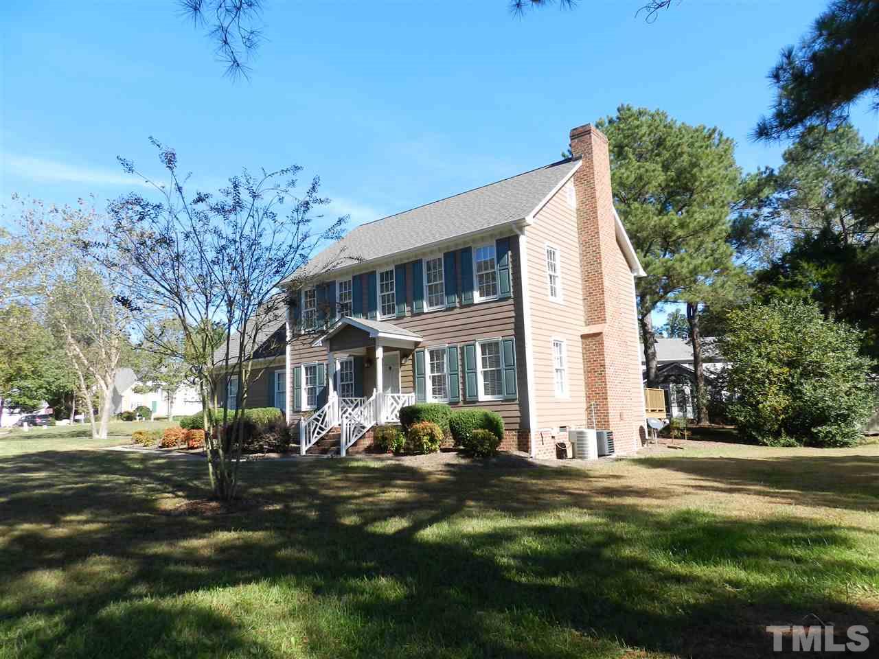 103 Rother Lane Durham, NC 27707 - Photo 23 of 24 a front view of a house with a garden